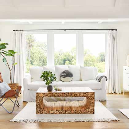 bright white living room at cottage with big windows