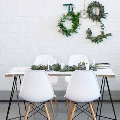 small dining room with wreaths hanging on the wall