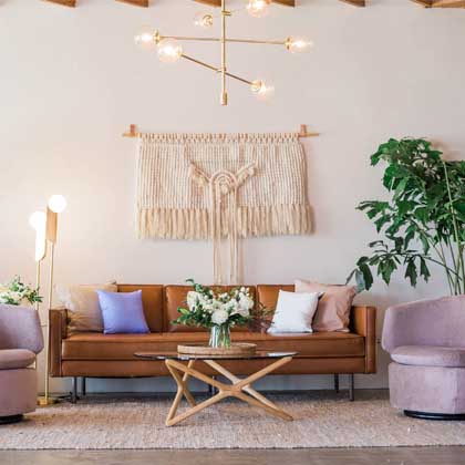leather chair and wood coffee table with flowers on it