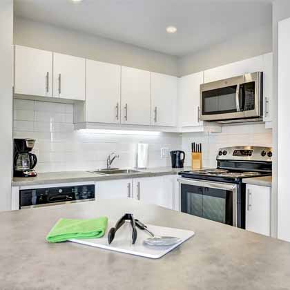 white and clean kitchen in Rockhill apartments in Montreal