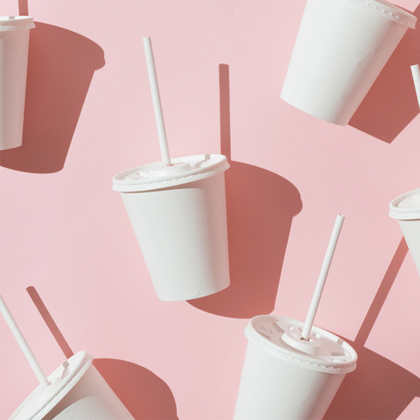 A large amount of cups with straws