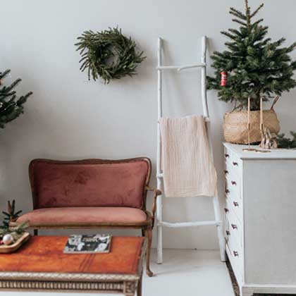 small tree on a table with holiday decor