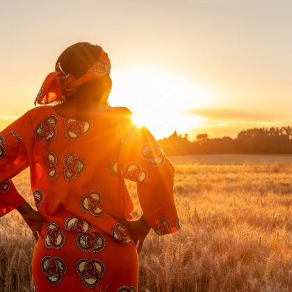 Indigenous woman looking into field