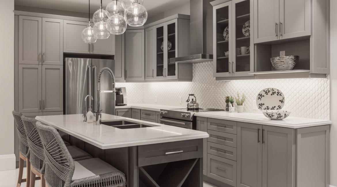 A kitchen with an island and chairs