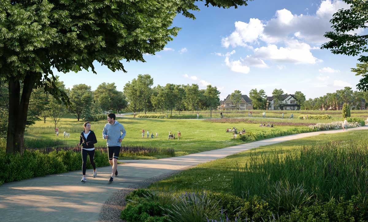 Couple running in the park. The Heights of Harmony in Oshawa.