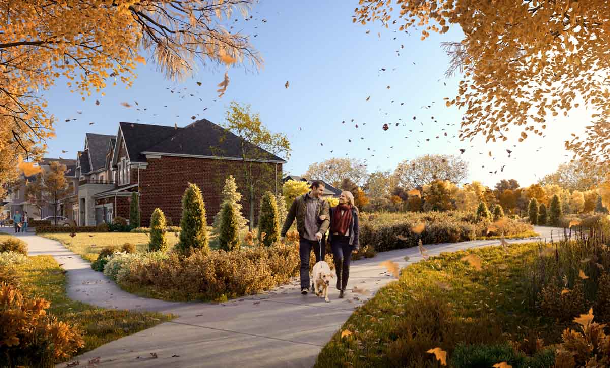 Couple walking in the park during the Fall season. The Heights of Harmony in Oshawa.