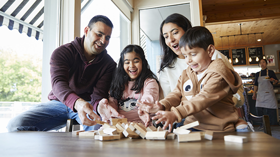 family playing in local coffee shop nearby Abbott's Run