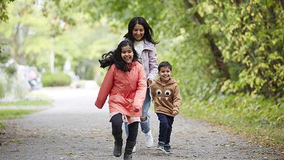 family walking a trail nearby Abbott's Run