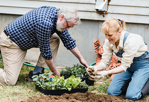 Couple Gardening at one of Minto Communities Calgary Projects