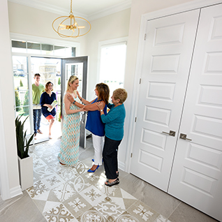 Greeting guests at the front of a Marquette home