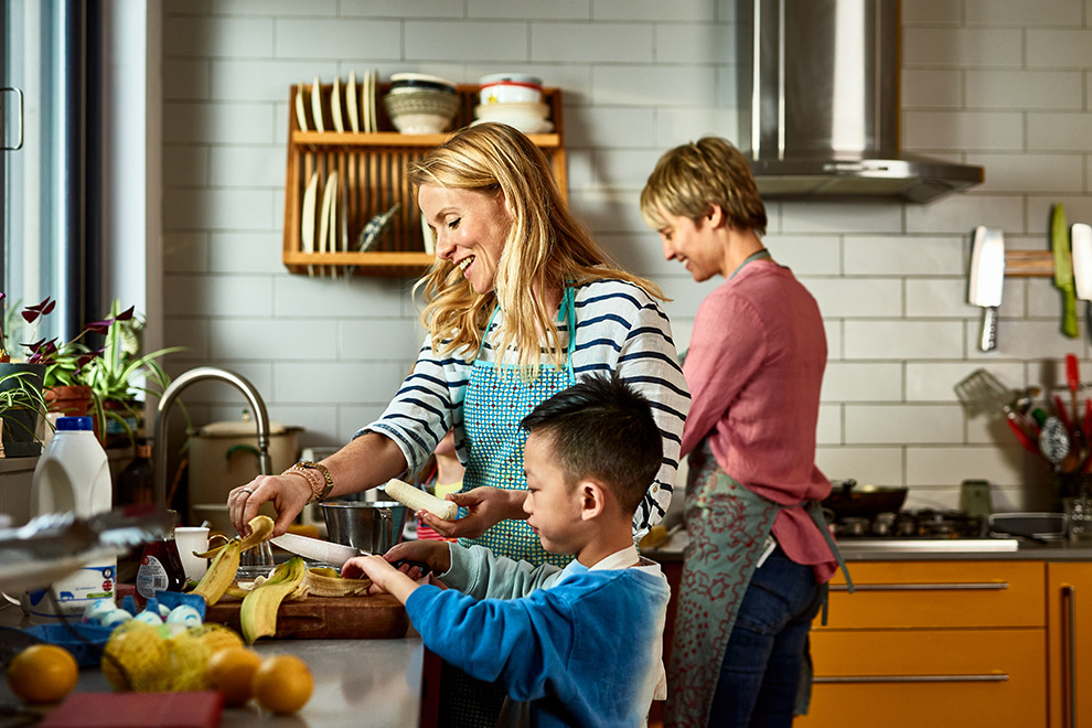 Mother and sons making a meal