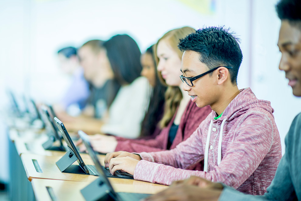 Students working on laptops. The 10 best things about Quinn’s Pointe in Barrhaven.