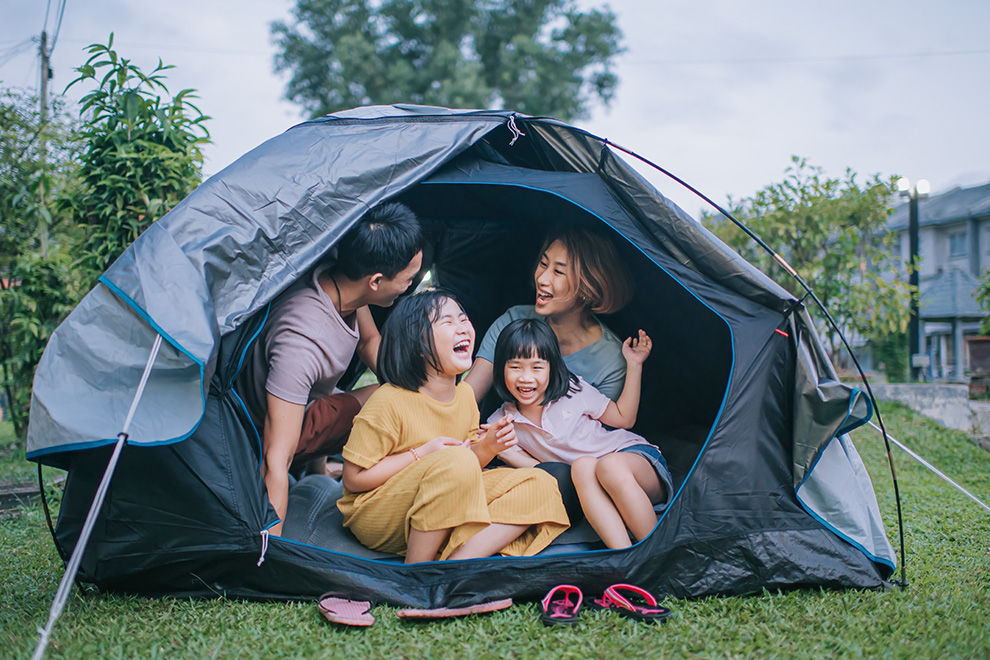 Family camping in the backyard