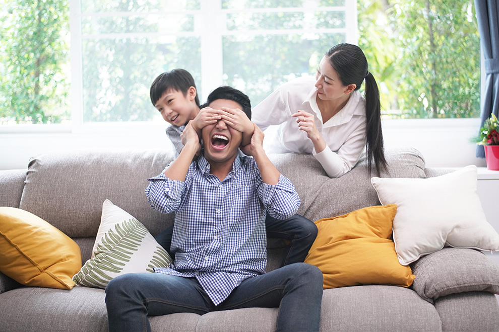 Family playing on the couch