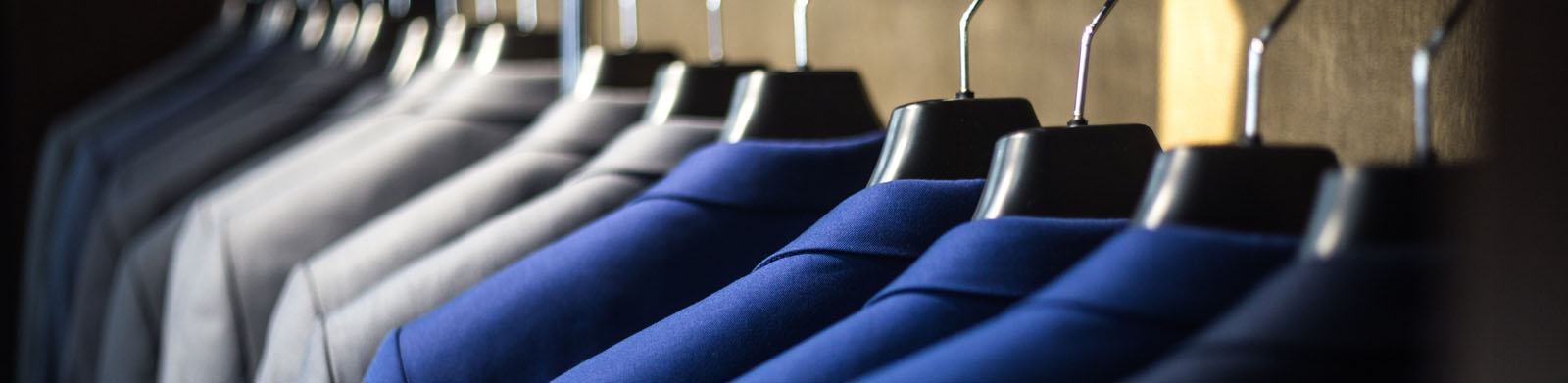 Rack of suits hanging up. Improving yourself. What you can do to find the Next You.