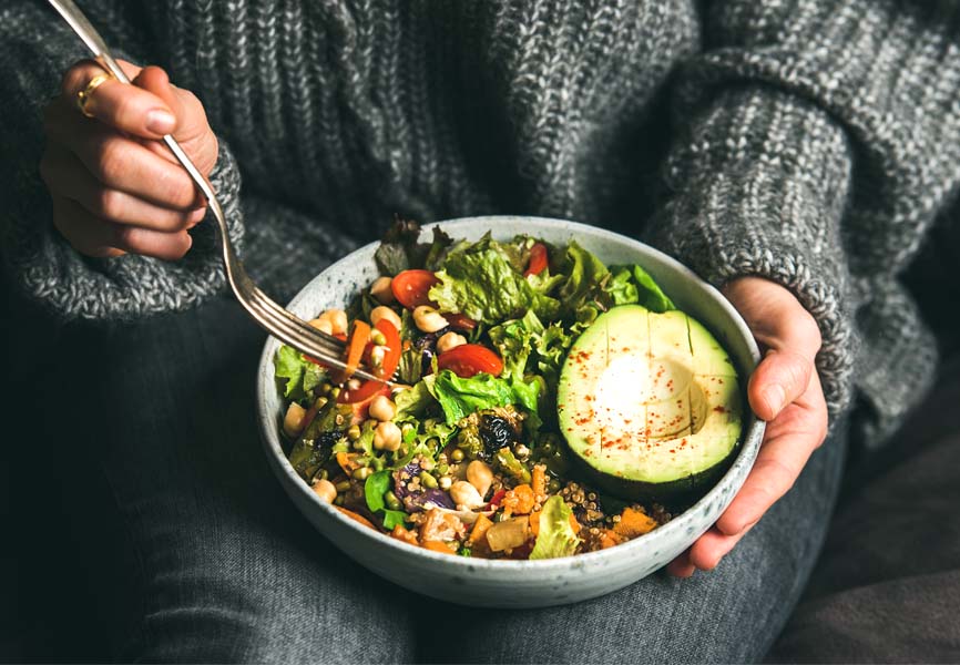 A woman eating a salad