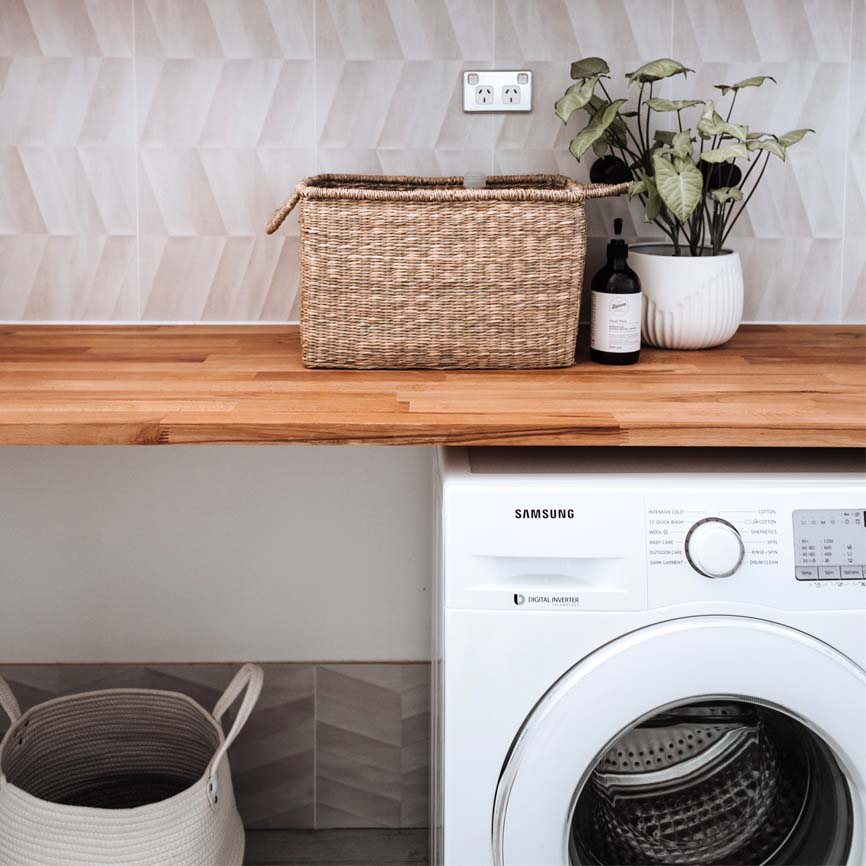 A washing machine in a laundry room