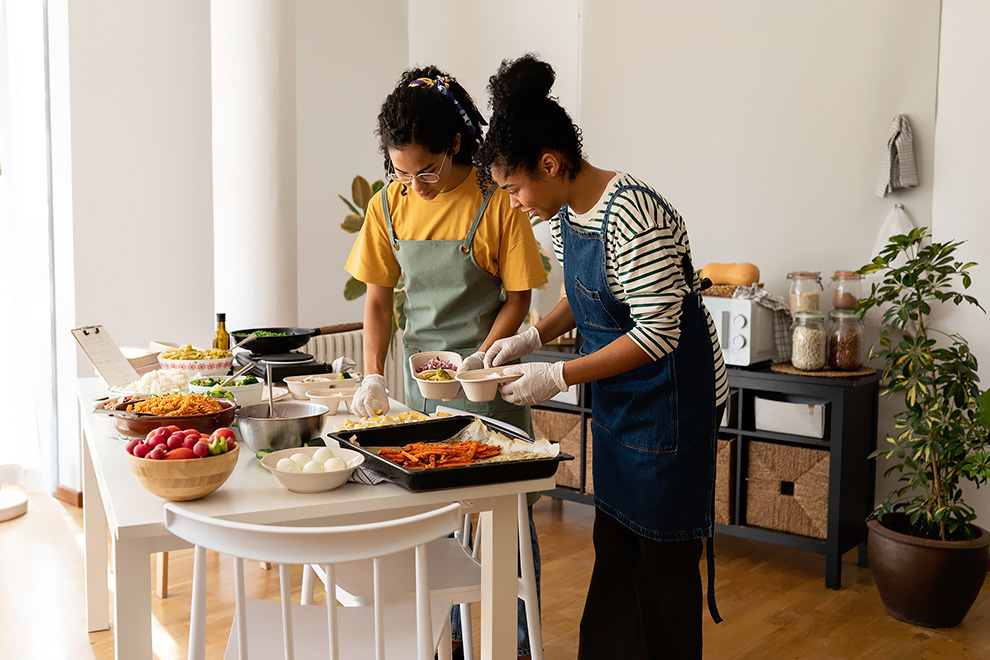 Friends cooking together