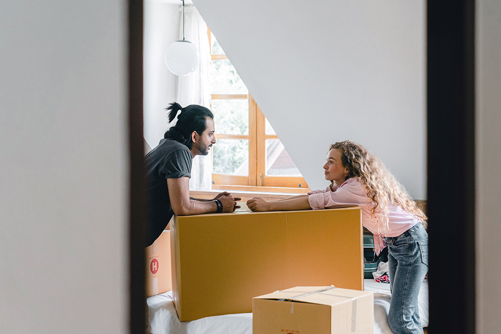 Couple unpacking boxes