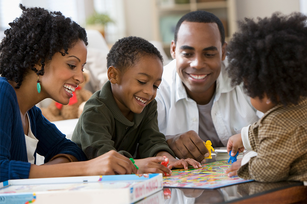 Family playing a board game