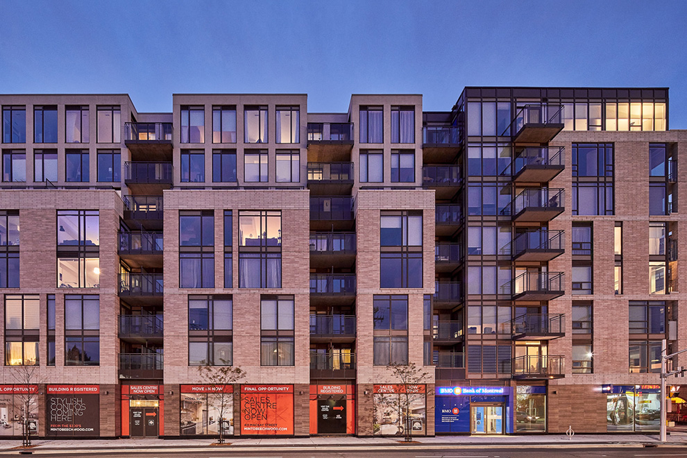 A full-width shot of the Minto Beechwood condominium taken in the evening.