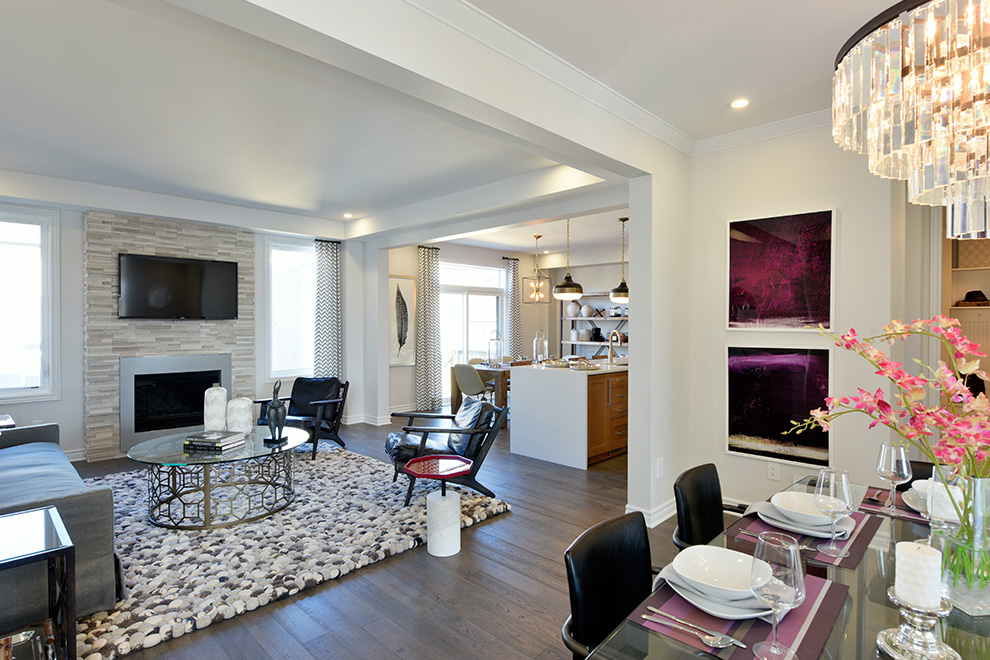 An interior shot of the Fitzroy Single Family Model Home shows off the great room and adjoining eat-in kitchen.