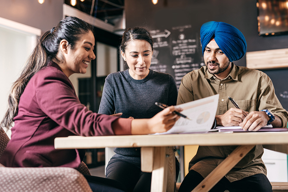 A couple attends their consultation appointment with their financial advisor.