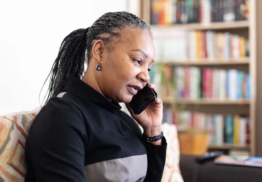 a woman sitting on the phone 