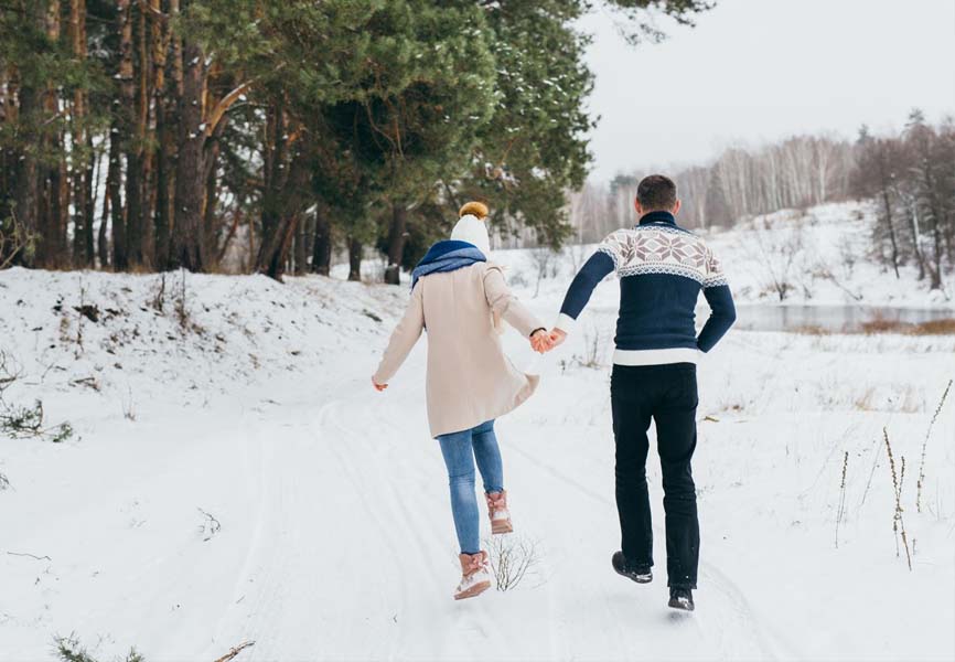 a couple going for a walk in the snow