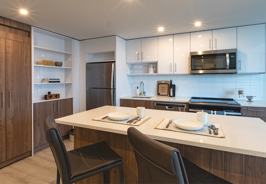 Reimagined open-concept kitchen in a one bedroom model suite at The International