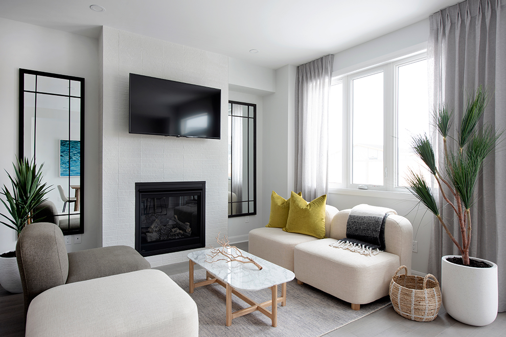 Living room with white sofas and yellow pillows