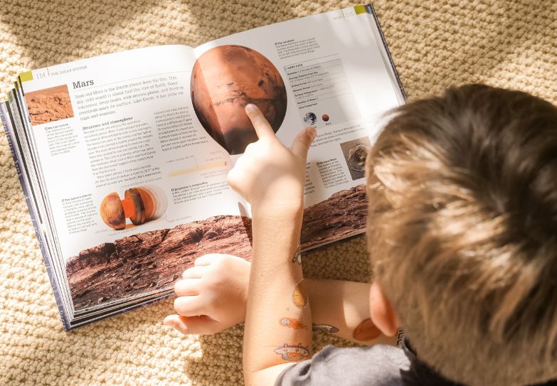 Child Reading a Book