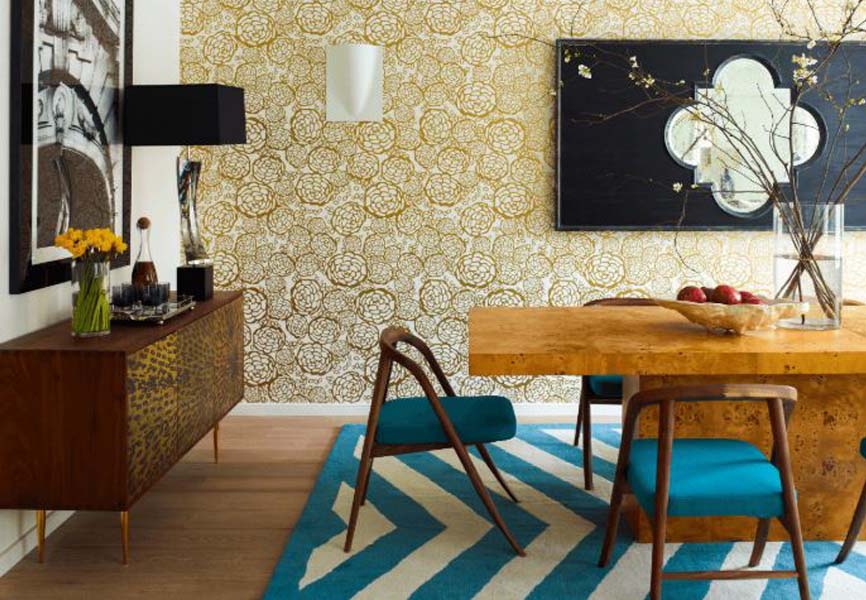 Dining room table with a yellow patterned background and a rug with a blue pattern