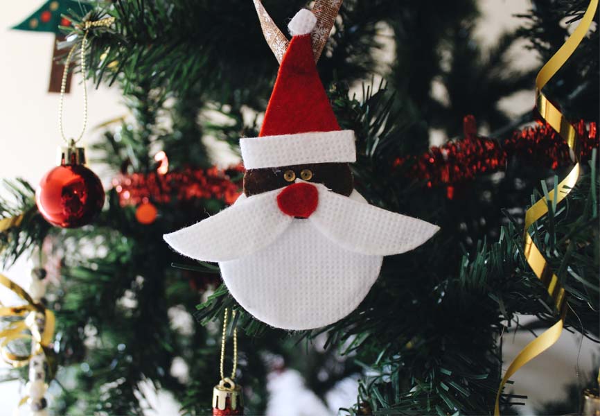 Santa Ornament Hanging from Tree