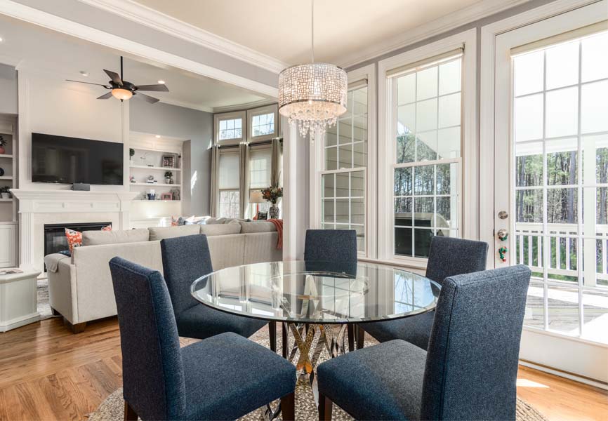 Dining room with a circular table and blue chairs