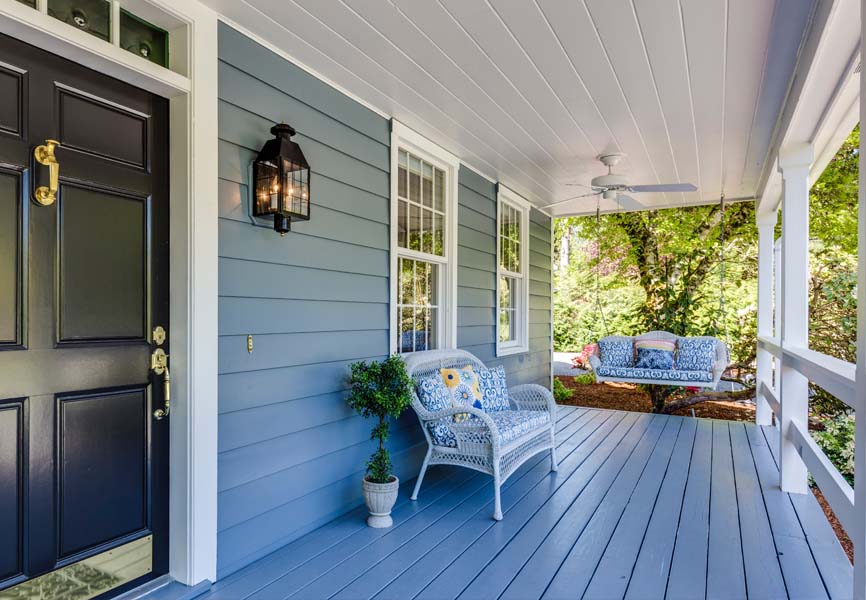 Front porch with a love couch and a porch swing 