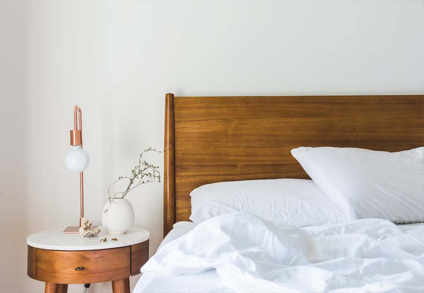 Rose Gold lamp on a side table 