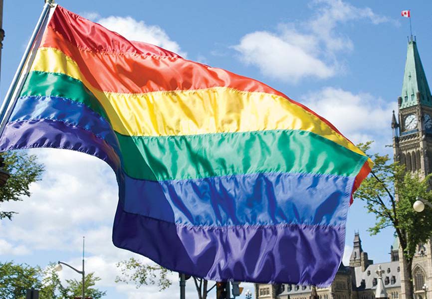 Rainbow flag flying in front of the parliament building 