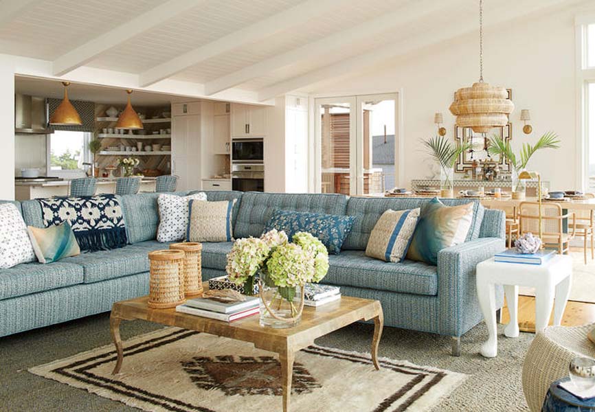 coastal living room with grey couch and wooden coffee table