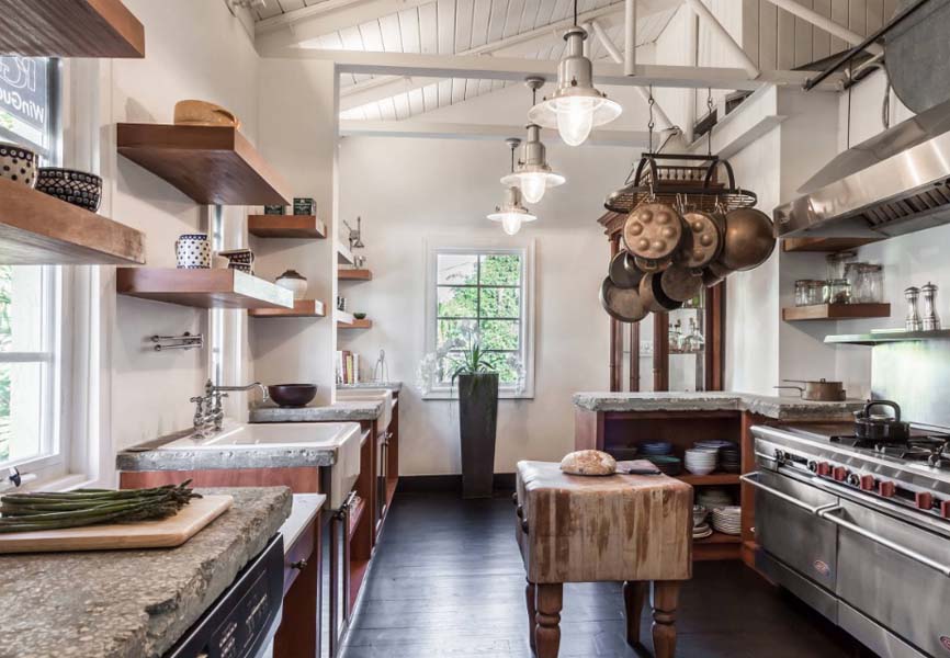 industrial style kitchen with wood accents and concrete floors