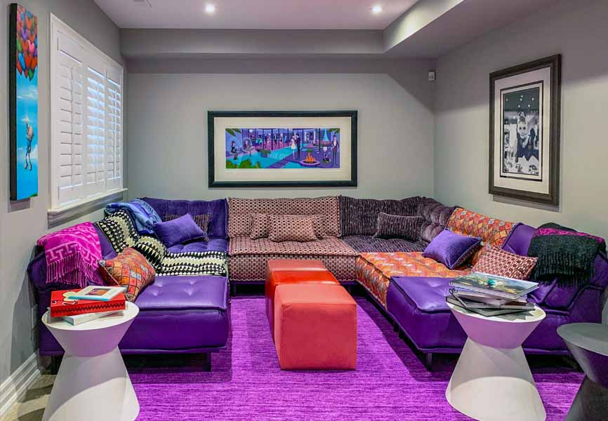 purple and red living room with floor couches