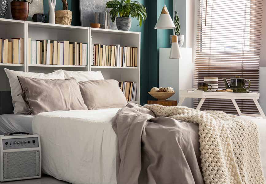 bed headboard shelf filled with books