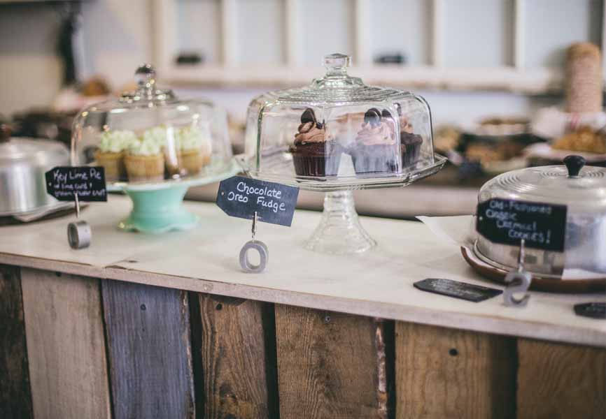 small coffee shop with pastries on the counter