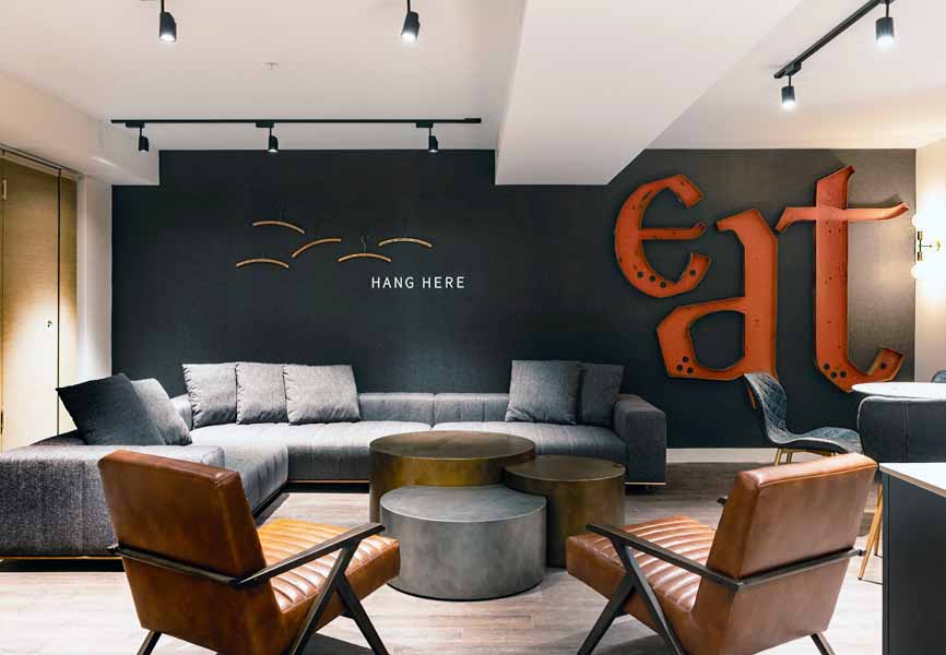 lounge space with antique art hanging on the walls