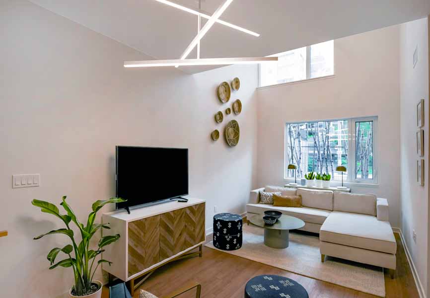 townhouse living room with vintage accents on walls and tables