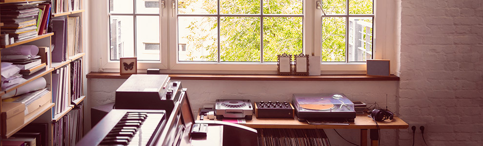 Small recording studio in apartment with piano and record player