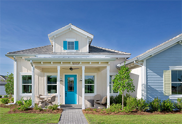 External view of paired luxury villas in Naples, Florida. New homes for sale, The Isles of Collier Preserve by Minto Communities.