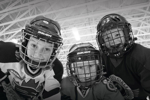 Young hockey kids posing for a picture at the Minto Recreational Complex. Things to do in Barrhaven.