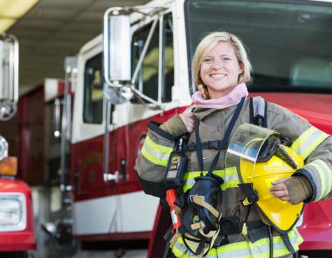 Firefighter standing outside her truck. Westlake by Minto Communities. New homes for sale in Palm Beach County, Florida