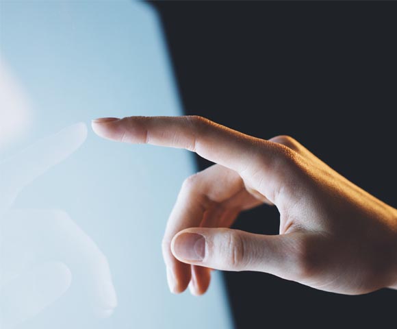 Minto Intelligence Hand on touch screen. New condos for sale at 123 Portland in King West, Toronto. Minto Communities.